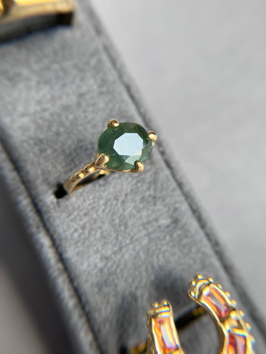 Large Jade Green Sapphire solitaire with a cheeky bottom