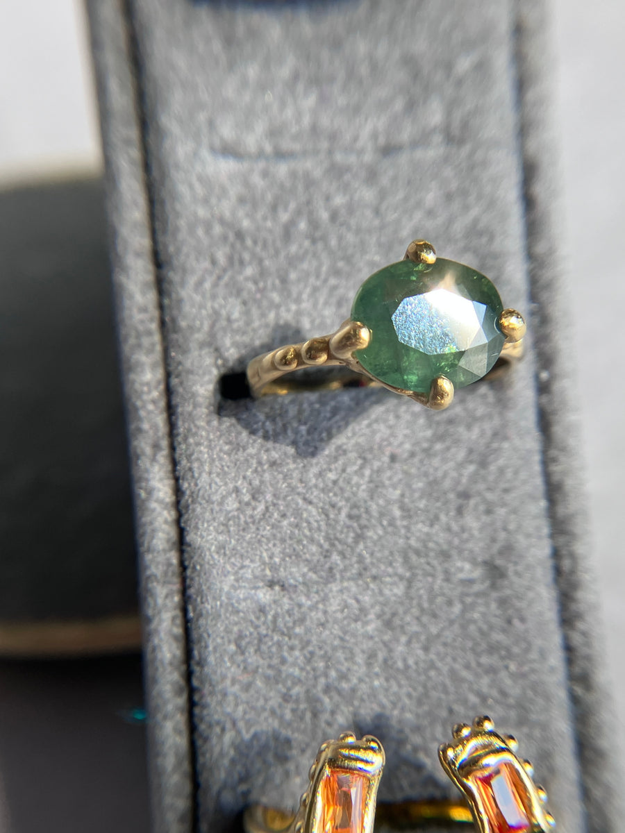 Large Jade Green Sapphire solitaire with a cheeky bottom