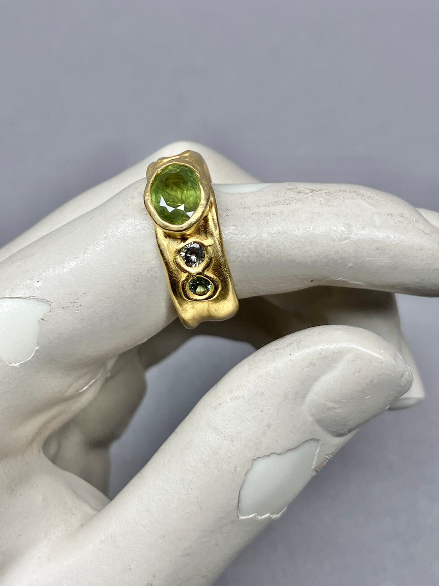 Large grass green sapphire with small Sapphires 1/2 Cigar