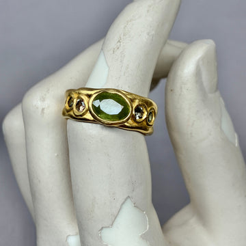 Large grass green sapphire with small Sapphires 1/2 Cigar