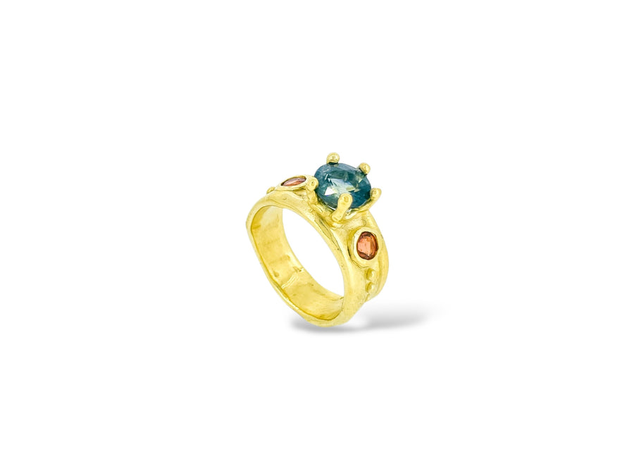 Radiant teal and orange sapphire ring